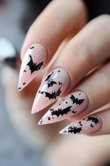 These soft pastel pink nails with bats and glitters are so cute... Giving  Barbie in halloween land kinda vibes here... What do you think? 👻🕷️🦇  #batnails #spookadorable #halloween2025 #halloweennailsdesign  #halloweennails #pinterestinspo ...