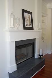 Black And White Fireplace Surround Black Granite With White Mantle Living Room Remodel Fireplace Surrounds Room Remodeling