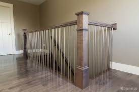 Stairsupplies™ offers a great iron baluster selection, that features powder coated finishes, combined with professional craftsmanship, that will last generations. Staircase With Modern Stainless Steel Spindles Handrail Design Railing Design Hardwood Floor Stain Colors