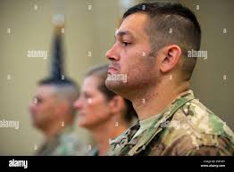 Maj. Michael Wetlesen, 822d Base Defense (BDS) commander, and Leadership  from the 820th Base Defense Group stand at the position of attention during  a change of command ceremony, June 20, 2018, at