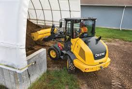 Wheel Loaders Riding A Robust Road Construction Equipment