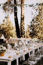 This Modern Outdoor Reception Features Long White Tables Ghost Chairs And Geometric Table Decor Portland Weddings Wedding Table Centerpieces Outdoor Wedding