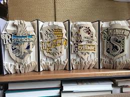 Harry Potter Hogwarts Houses Book Folding Completed 4 Book Etsy Harry Potter Hogwarts Houses Harry Potter Ravenclaw Harry Potter Theme
