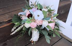 One thing we love to do is two types if centerpieces in one wedding reception space: Silk Sola Flower Bridal Bouquet Anemones Ranunculus Roses Blush Curiousfloral