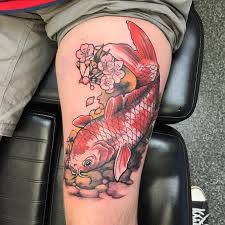 Golden koi fish tattoo on the left shoulder. 25 Awesome Koi Fish Tattoo Designs For Men