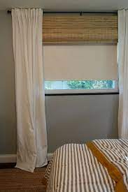 Duette® honeycomb shades with lightlock™. Bamboo Blings Hidind Roller Blinds At Bedroom Window Housetweaking Window Treatments Bedroom Layered Window Treatments Living Room Blinds