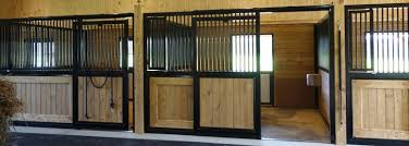 These dividers are created using wall channels and wall stiffeners to hold the boards that make up the divider wall. Horse Stalls Sunset Valley Metalcraft