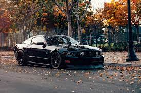 Stealthy Black Stanced Ford Mustang 5 0 Customized To Impress Ford Mustang Black Mustang Mustang