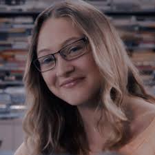 Guys I'm a terrible fan. On Next Class Maya is talking about all the people  around her who have died and she's like “my band mate died form a texting  and driving