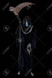 Hooded Skeleton On Black Background Grim Reaper The Death Stock Photo Picture And Royalty Free Image Image 110129030 A dark hooded figure in flowing black robes descends on the tiny body and reveals a wicked curved scythe. hooded skeleton on black background grim reaper the death
