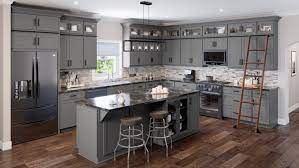 The dark gray cabinetry, light gray walls, and white subway. Storm Grey Shaker Rta Kitchen Cabinets