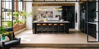 Gray open plan kitchen with blue island. A Reveal Of Our Queer Eye Season 3 Loft The Kitchen Bobby Berk
