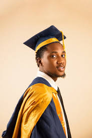 Young Graduate in Cap and Gown Portrait · Free Stock Photo