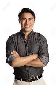 Cool Laid Back Man Wearing A Grey Shirt With Rolled Up Sleeves And Khaki Pants Standing With A Big Smile Against A White Background Stock Photo Picture And Royalty Free Image Image