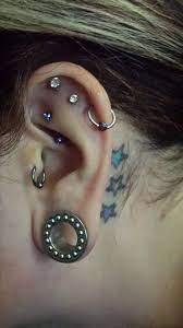 My Left Ear What Was A Triple Helix Got Infected So We Pierced A Triple Cartilage The Bottom Earring Was Too Small A Triple Helix Star Tattoos Behind Ear Ear