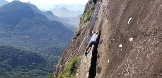 In the video, the woman slides down the rock face just centimetres from a sheer drop. One Of My Favorite Trails Pedra Da Gavea Parque Da Tijuca Rio De Janeiro Brazil Hiking