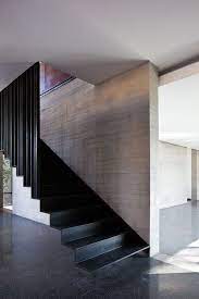 Simple black metal stair rail with wood cap for warmth. Gallery Of Fuentes House Dmp Arquitectura 5 Stairs Design Staircase Design Modern Staircase