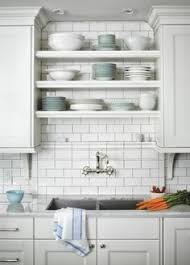 Open Shelving No Window Sink With Wall Mount Faucet Kitchen Sink Decor Kitchen Remodel Small Tidy Kitchen