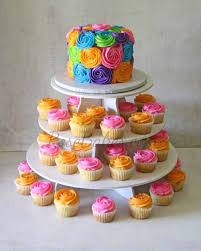 The top tier includes a cute gray whale. Bright Baby Shower Cake Cupcakes Cake Pops And Candy Apples Rose Bakes