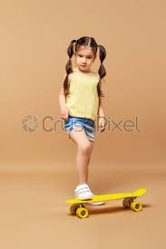 How to ride a skateboard. Little Girl Learning To Ride Skateboard Stock Photo Crushpixel