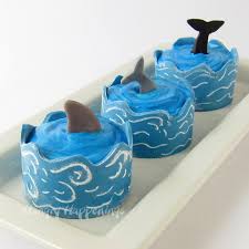 Follow the directions on the back of the cake mix packet, and once the cupcakes are done, set them out on a wire rack, and allow them to cool. Ocean Cupcakes With Edible Cupcake Wrapper Waves