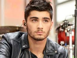 The former one direction singer had asked his mother to talk to his fiancee. Zayn Malik Covers Up Perrie Edwards Tattoo