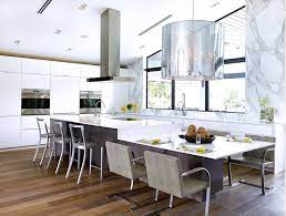 They can serve as extra prepping surfaces when you're cooking and brass and marble enthusiasts will love this kitchen island table that adds a glamorous flair to any kitchen. Table Extension Merge Your Island With Your Kitchen Table For A Seamless And Functional Kitchen Island Dining Table Modern Kitchen Island Dream Kitchen Island