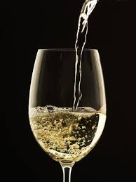 Cropped view of of boyfriend pouring wine for girlfriend. White Wine Pouring From Bottle Into Glass Photographic Print John Hay Art Com