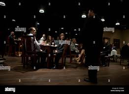 Mr. Paul Chapa, founder of Food Industry Feeding Heroes (FISH) speaks with  honored guests after the FISH dinner, at Iron Mike's lounge