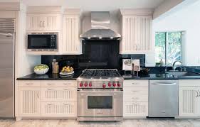 Putting tile behind stove in kitchen. Solid Slab Backsplash Everything You Need To Know