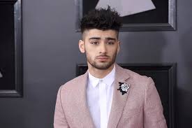 Why is zayn malik rated a 9.5or10/10 i get that he has a symmetrical face  and is very pretty boy but nothing as striking but is compared in league of  henry caviall
