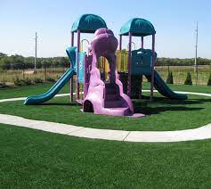 Artificial Grass Synthetic Turf Features A Unique Blend Of Polyethylene Monofilament Fibers And Thatch Layer Playground Turf Artificial Grass Artificial Turf