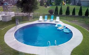 Another Great Round Swimming Pool With Tanning Ledges Tanningledges Tanningledge Swimming Pool Prices Swimming Pools Inground Inground Pool Designs