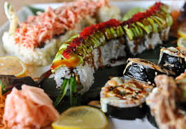 Zest Sushi And Tapas Bar Roswell Canton Roll Left Flash Fried California Roll Topped With Spicy Crab Salad Eel Sauce Center Caterpillar Roll Center