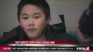 VIDEO: Boy swept away by fast-moving creek reunited with Santa Ana police  who saved him