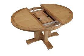 This round table is available in different kinds of wood finishes and could perfectly decorate any contemporary dining room. Expandable Round Dining Table Plans Layjao