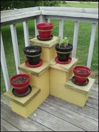 I Came Up With This Idea For A Low Cost Plant Stand 3 8x16 Cement Blocks And 3 8x8 Blocks And A 2x10 Pressure Diy Plant Stand Plant Stand Budget Backyard
