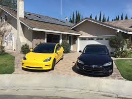 The original and largest tesla community on reddit! Yellow Tesla Model 3 That Rocked Reddit Now With Tinted Windows And Carbon Fiber Dash Tesla Model Tesla Tesla Model S