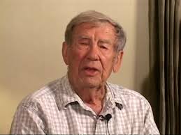 Clarence Terry, platoon leader from Arco, Idaho [cle]ans his nails with a  trench knife after the Battle at Hastings Ridge"