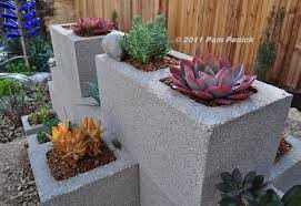Built to jazz up the area surrounding a hot tub, this wall was crafted with chicken wire and cement, then cured, stained and sealed. Make A Cinderblock Wall Planter Digging