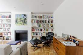 Bookshelves are a great way to frame a fireplace, fitted on either side or above it. 7 Custom Bookcases Show How To Create A Home Library Sweeten Com