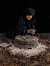 grinding a grain of some sort life in egypt baghdad iraq iraqi women