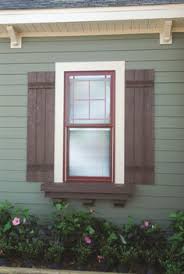It is an old wooden shutter that is a chocolate brown color and very distressed. 20 Stylish Window Shutters Ideas Window Shutters Shutters Shutters Exterior