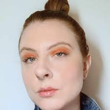 Use an eyeshadow brush to sweep a dark shade of eyeshadow onto your lids going from your lashes to the crease. 5 Simple Orange Eyeshadow Looks To Try