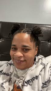 Passport photo with styled locs and makeup