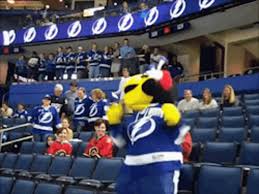 Coleman's smiling wife and baby daughter stand with the lightning's team mascot, a yellow lightning bug costumed character. Tampa Bay Lightning Thunderbug Gif Tampabaylightning Thunderbug Dancing Discover Share Gifs