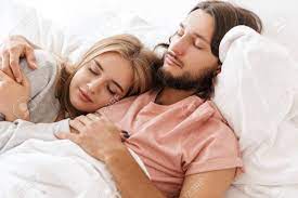 Onenight a married couple are laying in bed. Beautiful Young Couple Laying In Bed At Home Embracing While Stock Photo Picture And Royalty Free Image Image 139576605
