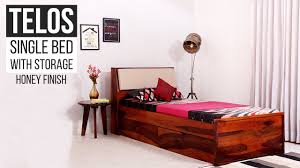 Single Bed Buy Telos Single Bed With Storage Honey Finish Online Wooden Street Youtube Wooden bed with pillows and crumpled light blanket in white room with green carpet. single bed buy telos single bed with storage honey finish online wooden street