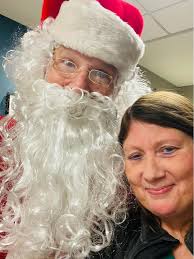 The Wolf Moon behind a cloud bank above Fort Mackinac early this morning