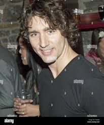 Liberal Member of Parliament Justin Trudeau shares a beer with patrons of  the Aulde Dubliner pub in Byward Market of downtown Ottawa, Ontario before  weighing in with opponent Conservative Senator Patrick Brazeau,